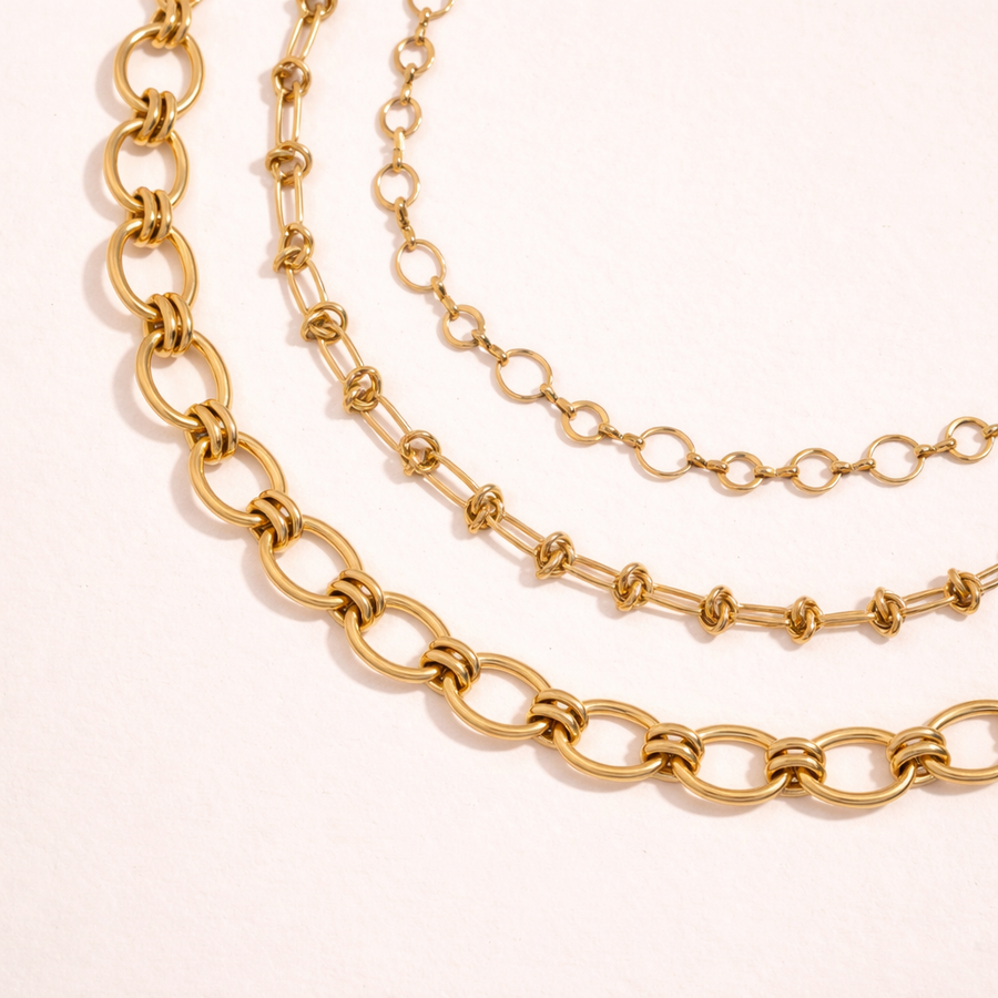 Two gold chains stacked 