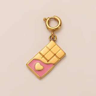Gold charm with pink heart