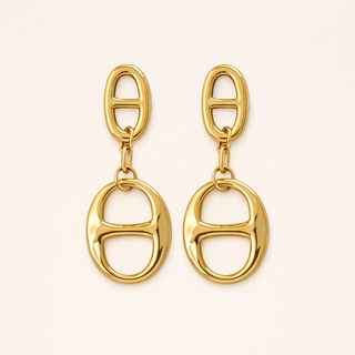 Bold gold oval link earrings with a smooth polished finish for modern everyday and statement styling.
