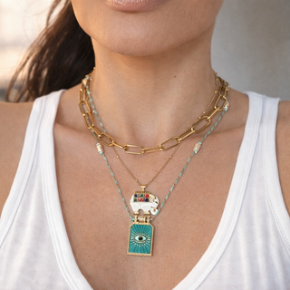 Woman wearing a gold chain Lucky Elephant Necklace