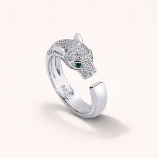 Silver panther-shaped ring with green gemstone 