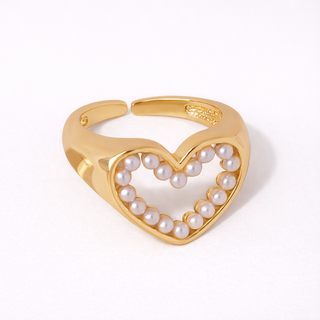 Gold heart-shaped ring with pearls 