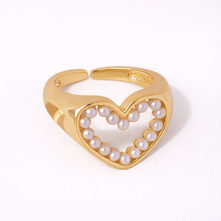 Gold heart-shaped ring with pearls 