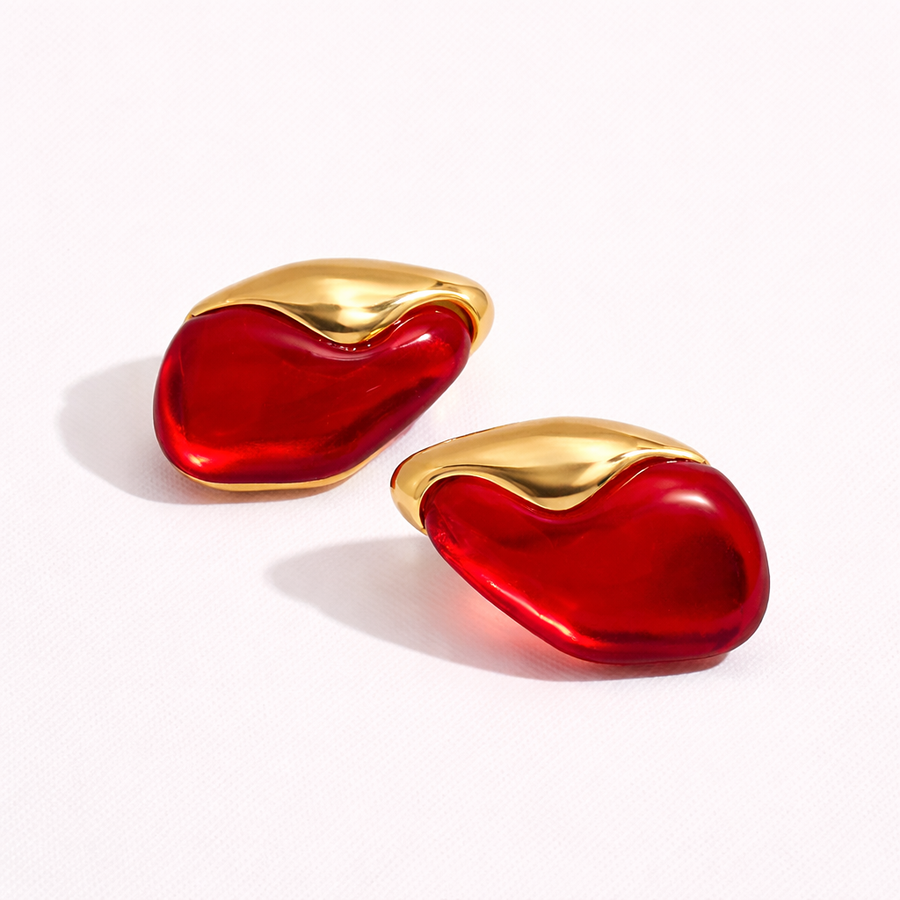 Pair of red earrings with gold tops