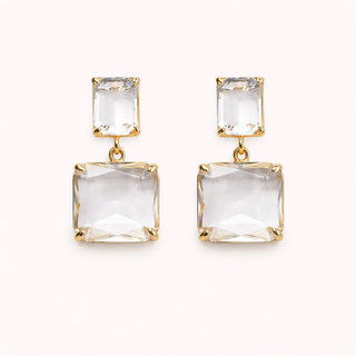 smoddo Gold earrings with clear square stones on a white background