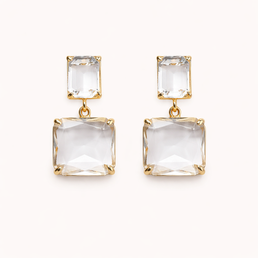 smoddo Gold earrings with clear square stones on a white background