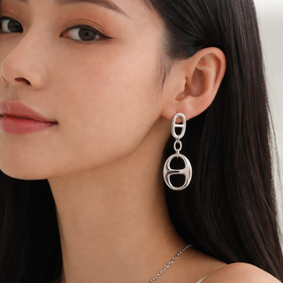 Silver Eclipse earrings featuring bold oval link design in high-polish silver finish for modern statement styling.