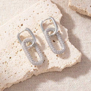 Silver hoop earrings with gemstone accents