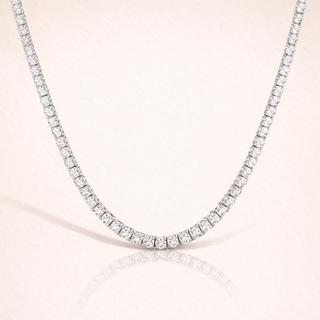 Diamond necklace on a light pink background