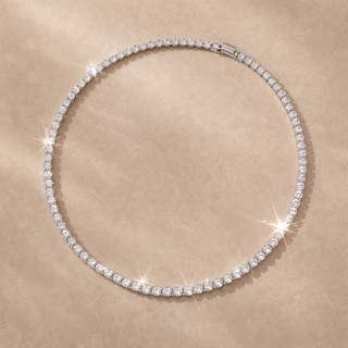 Diamond necklace on a beige fabric background