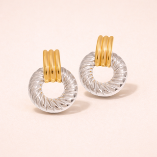Pair of Solaro Earrings with gold and clear circular designs