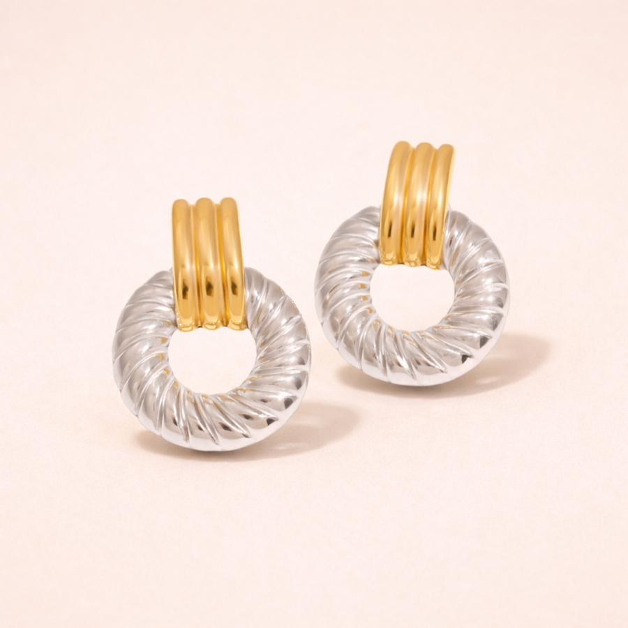 Pair of Solaro Earrings with gold and clear circular designs