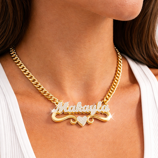 A gold necklace featuring a diamond-studded name, elegantly worn by a woman.