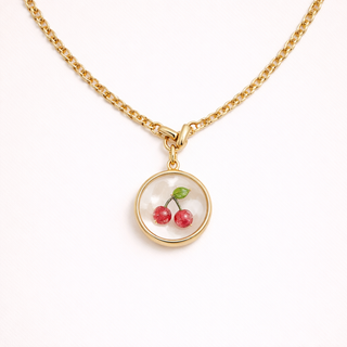 Gold necklace with a cherry pendant 