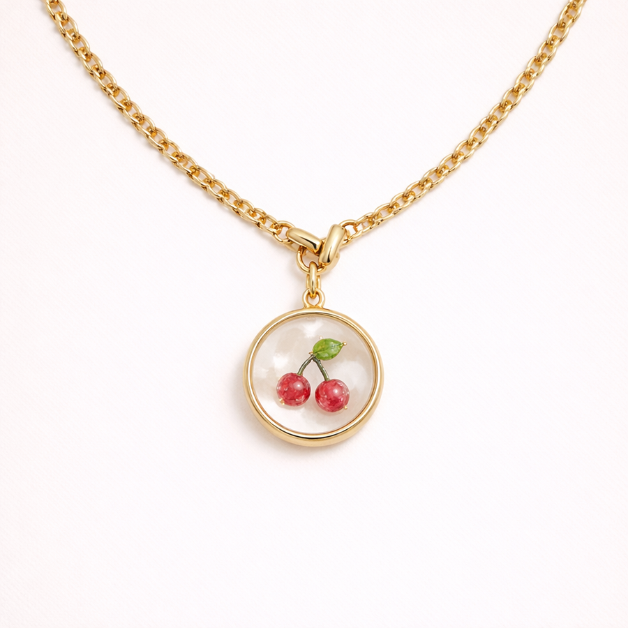 Gold necklace with a cherry pendant 