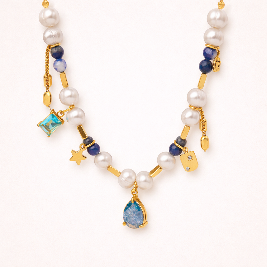Pearl necklace with blue and gold accents on a white background