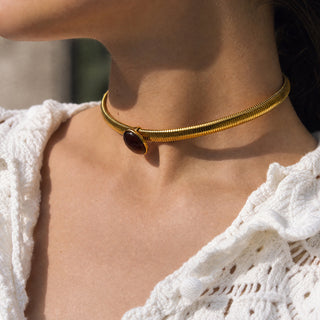 Close-up of the Layered Trio necklace worn on the neck