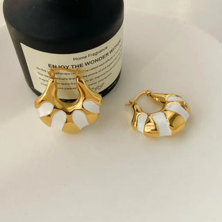 gold striped hoop earrings elegant and modern jewelry.
