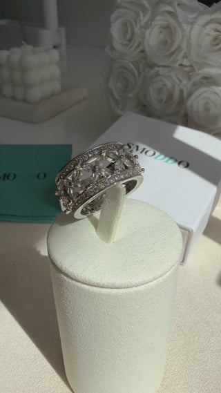 Close-up of Vintage Flower Ring showing pavé cubic zirconia stones in a floral motif with rhodium PVD finish