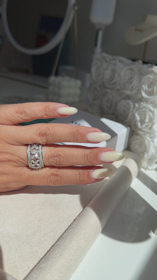 On-hand / lifestyle shot:
Vintage Flower Ring worn on finger showing delicate floral cubic zirconia design in rhodium PVD finish