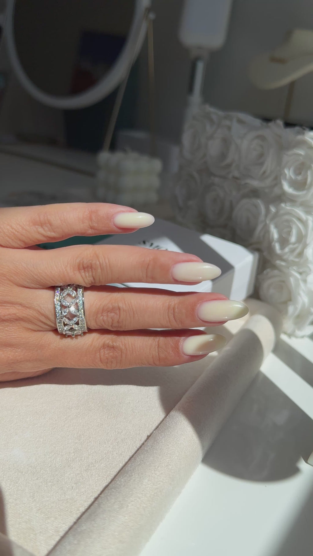 On-hand / lifestyle shot:
Vintage Flower Ring worn on finger showing delicate floral cubic zirconia design in rhodium PVD finish