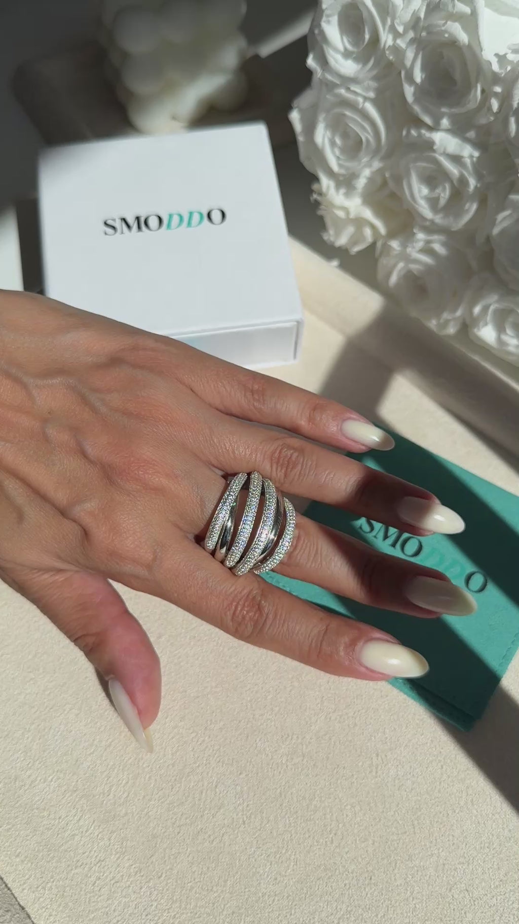 Here are the alt texts for all the Dazzle Band Ring images in Shopify — written for SEO and accessibility:

Primary image (main product shot):
Dazzle Band Ring in 18K gold vermeil with six intertwined bands and over 330 pavé cubic zirconia stones on a 925 sterling silver base
On-hand / lifestyle shot:
Dazzle Band Ring worn on finger showing layered multi-band sparkle in gold vermeil finish
White gold / rhodium variant shot:
Dazzle Band Ring in white gold vermeil with six pavé cubic zirconia bands on 925 ste