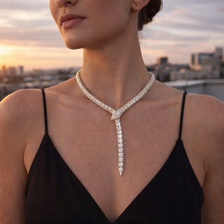 Woman wearing a sparkling diamond necklace with a cityscape in the background