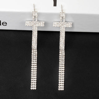 smoddo tassel letter Cross-shaped earrings with rhinestone detailing on a black background