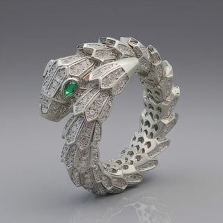 SMODDO adjustable snake ring in Silver snake-shaped ring with green gemstone on a gray background