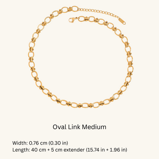 Gold oval link bracelet on a white background