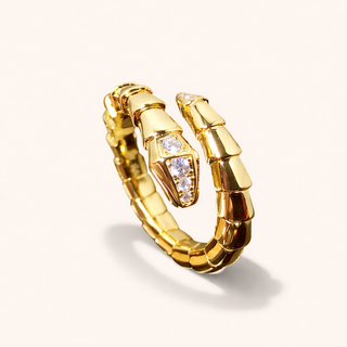 Gold ring with diamond accents on a light gray background